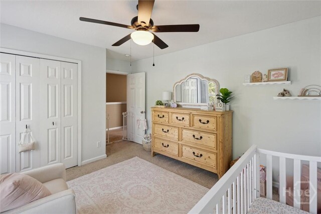 43 Godley Park Way, Savannah, GA 31407 - bedroom with light colored carpet, a closet, a crib, a ceiling fan, and baseboards