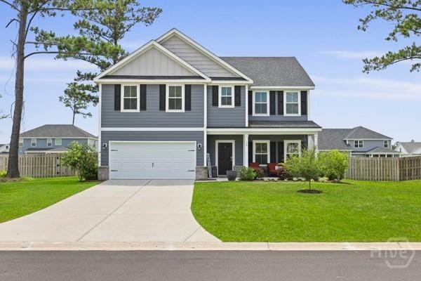 150 Pitch Point Trl, Richmond Hill, GA 31324 - craftsman-style home featuring driveway, a porch, a garage, and board and batten siding