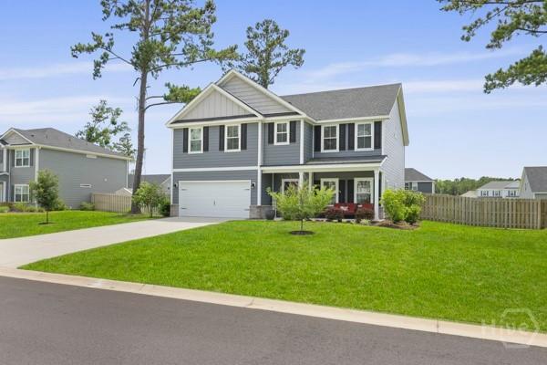 150 Pitch Point Trl, Richmond Hill, GA 31324 - view of front of house featuring a garage and driveway