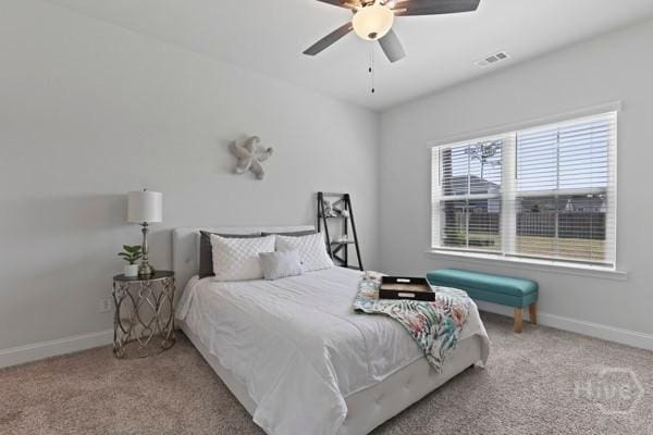 150 Pitch Point Trl, Richmond Hill, GA 31324 - bedroom with carpet floors, baseboards, and ceiling fan