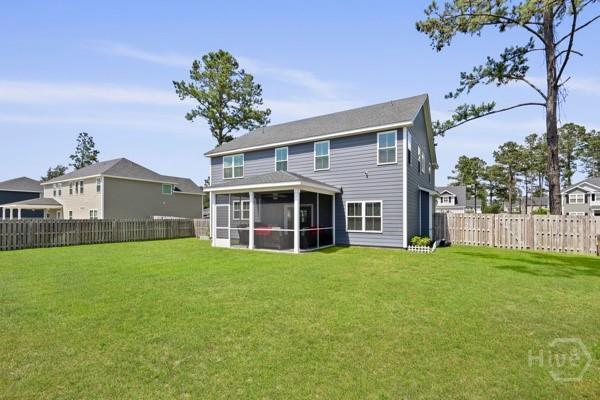 150 Pitch Point Trl, Richmond Hill, GA 31324 - rear view of house with a sunroom