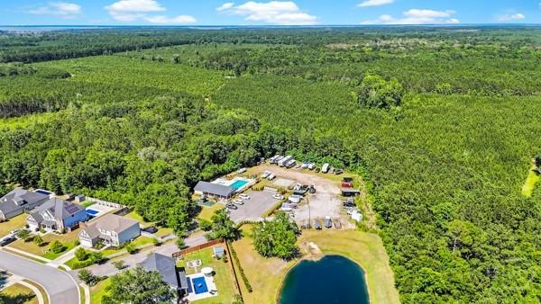 150 Pitch Point Trl, Richmond Hill, GA 31324 - aerial view of a heavily wooded area and a large body of water