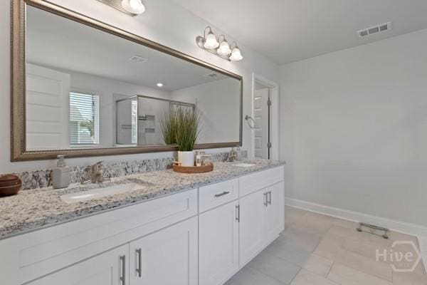 150 Pitch Point Trl, Richmond Hill, GA 31324 - bathroom featuring double vanity, a shower stall, tile patterned floors, and baseboards