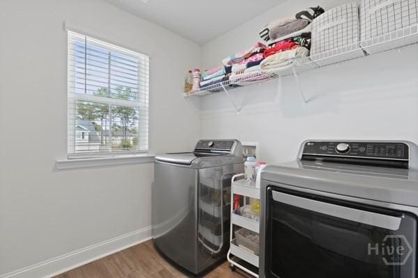 150 Pitch Point Trl, Richmond Hill, GA 31324 - washroom featuring wood finished floors, independent washer and dryer, and baseboards