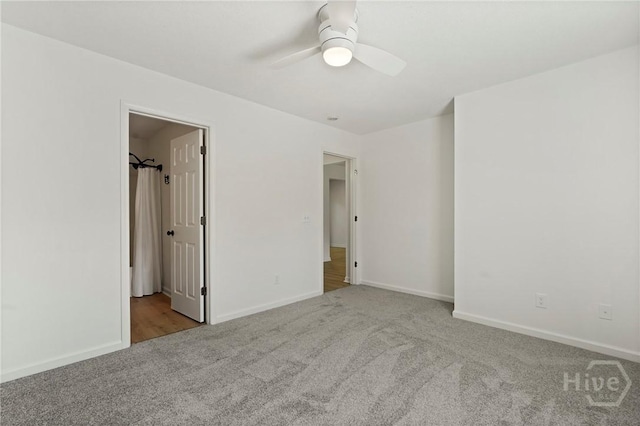 210 Walker Dr, Guyton, GA 31312 - unfurnished bedroom with carpet, baseboards, and ceiling fan