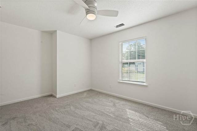 210 Walker Dr, Guyton, GA 31312 - carpeted empty room featuring ceiling fan, baseboards, and a textured ceiling