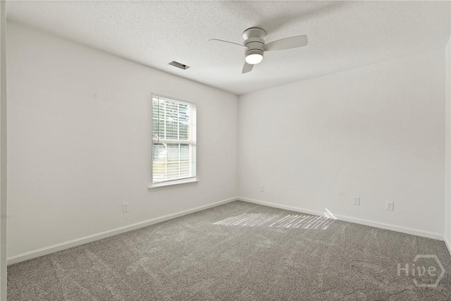 210 Walker Dr, Guyton, GA 31312 - carpeted empty room with a ceiling fan, baseboards, and a textured ceiling