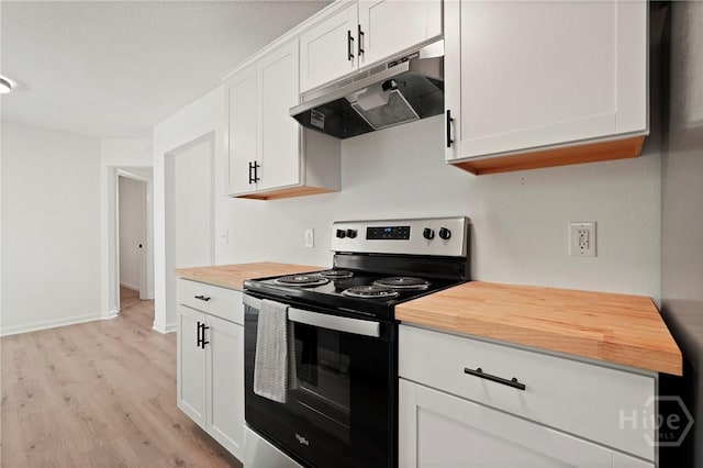 210 Walker Dr, Guyton, GA 31312 - kitchen featuring stainless steel electric stove, under cabinet range hood, wooden counters, light wood-style flooring, and white cabinetry