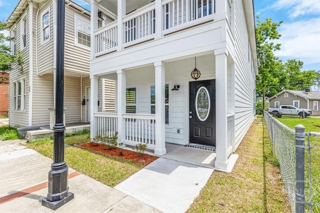 716 Waters Ave, Savannah, GA 31404 - view of exterior entry with a porch and a balcony