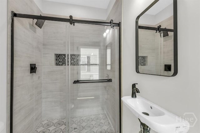 716 Waters Ave, Savannah, GA 31404 - full bath with a stall shower, a sink, and tile patterned flooring