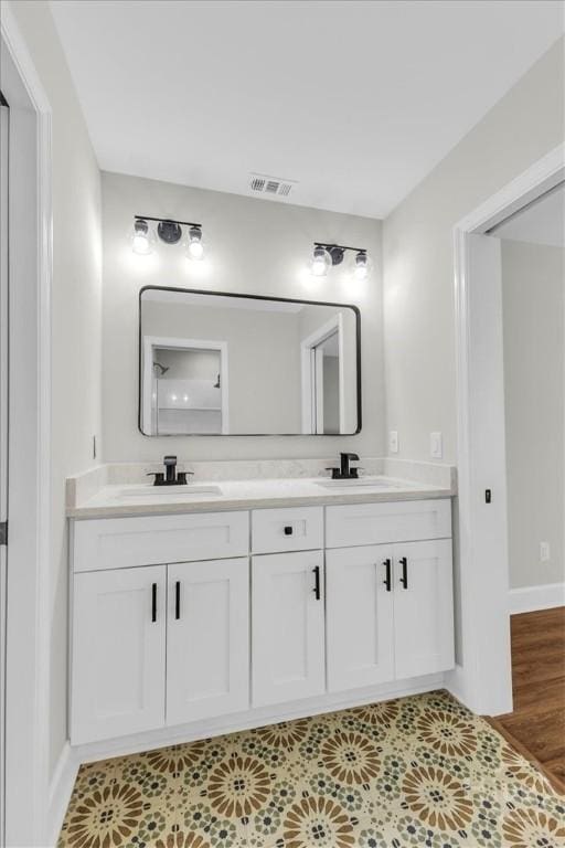 716 Waters Ave, Savannah, GA 31404 - full bath with double vanity and baseboards