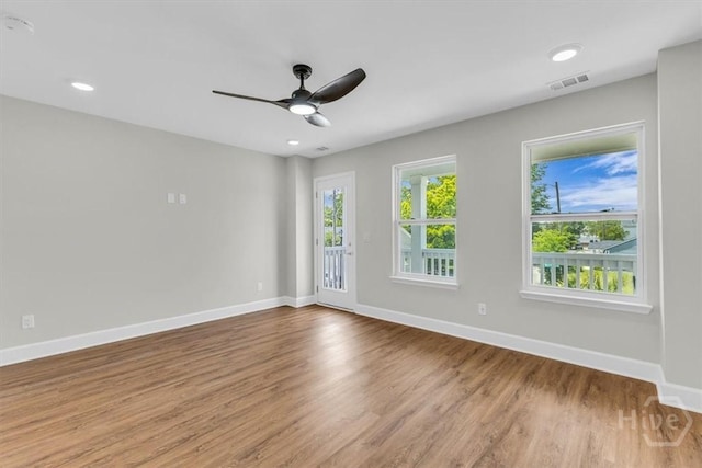 716 Waters Ave, Savannah, GA 31404 - unfurnished room with baseboards, wood finished floors, a ceiling fan, and recessed lighting