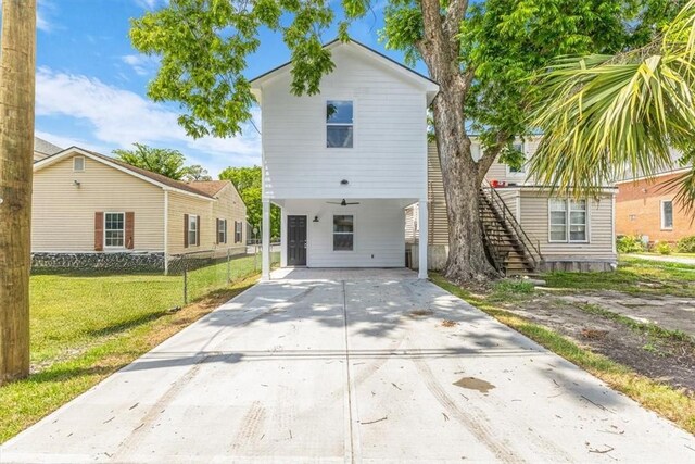 716 Waters Ave, Savannah, GA 31404 - view of front of property with a carport, concrete driveway, and stairway
