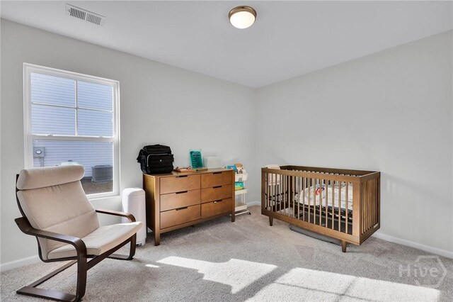 22 Stetson Dr, Savannah, GA 31419 - bedroom featuring baseboards, carpet flooring, and a nursery area