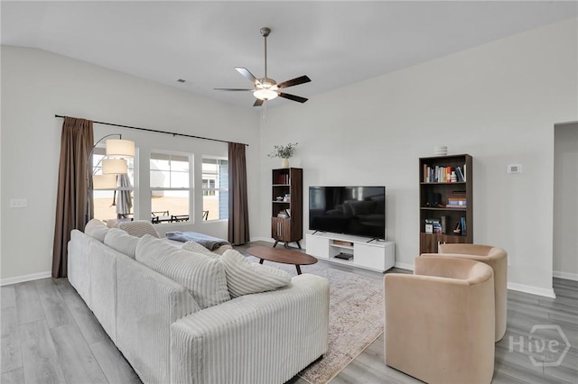 22 Stetson Dr, Savannah, GA 31419 - living room with a ceiling fan, light wood-style floors, baseboards, and lofted ceiling