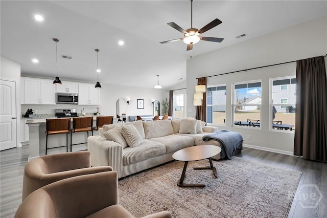 22 Stetson Dr, Savannah, GA 31419 - living room with lofted ceiling, a ceiling fan, wood finished floors, and recessed lighting