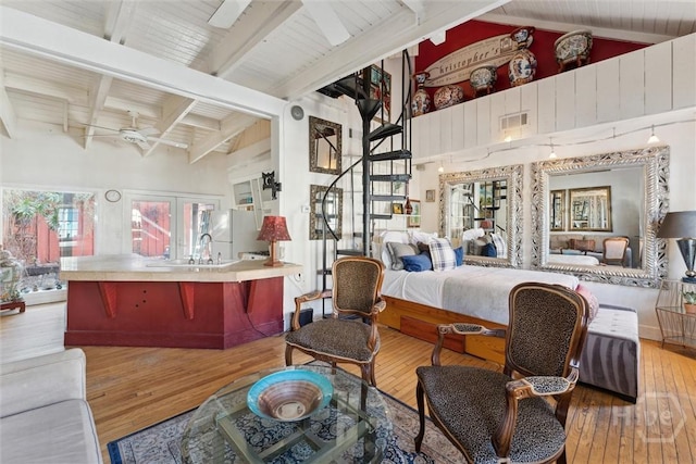 529 E Gordon St, Savannah, GA 31401 - bedroom featuring freestanding refrigerator, wood-type flooring, a sink, and french doors