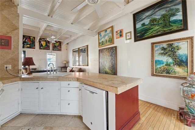 529 E Gordon St, Savannah, GA 31401 - kitchen featuring white dishwasher, beamed ceiling, a peninsula, a ceiling fan, and a sink