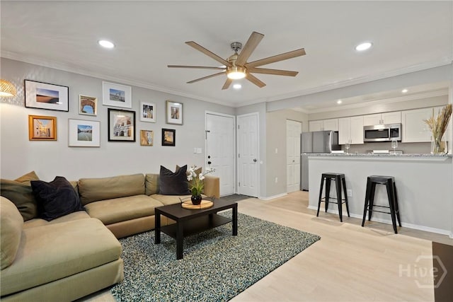 12300 Apache Ave Unit 1719, Savannah, GA 31419 - living room with a ceiling fan, recessed lighting, light wood-style flooring, crown molding, and baseboards