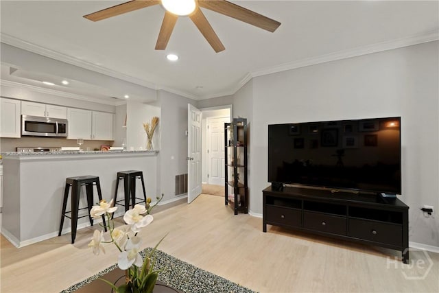 12300 Apache Ave Unit 1719, Savannah, GA 31419 - living area featuring light wood-type flooring, a ceiling fan, baseboards, crown molding, and recessed lighting