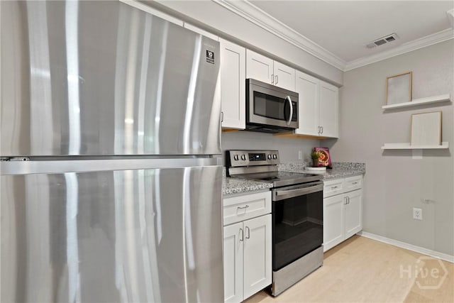 12300 Apache Ave Unit 1719, Savannah, GA 31419 - kitchen featuring stainless steel appliances, crown molding, white cabinetry, light stone countertops, and light wood-style floors