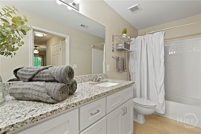 12300 Apache Ave Unit 1719, Savannah, GA 31419 - bathroom with toilet, vanity, shower / bath combo, wood finished floors, and ceiling fan