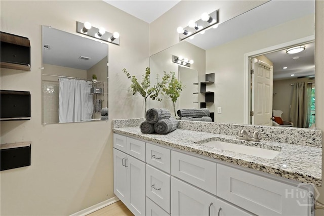 12300 Apache Ave Unit 1719, Savannah, GA 31419 - bathroom featuring vanity, curtained shower, and baseboards