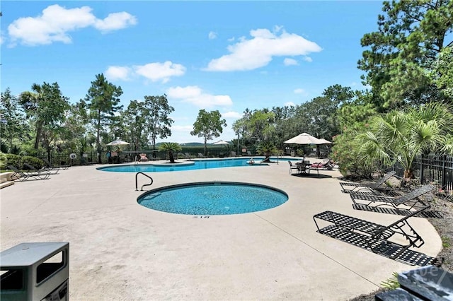 12300 Apache Ave Unit 1719, Savannah, GA 31419 - community pool featuring a patio and view of scattered trees