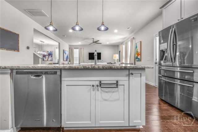 103 Safari Trl, Pooler, GA 31322 - kitchen with appliances with stainless steel finishes, recessed lighting, dark wood finished floors, light stone countertops, and ceiling fan