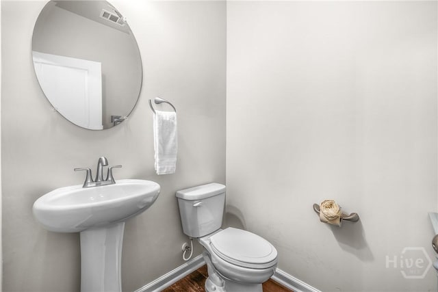 103 Safari Trl, Pooler, GA 31322 - bathroom featuring toilet, wood finished floors, baseboards, and a sink