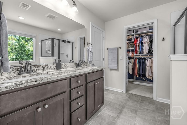 103 Safari Trl, Pooler, GA 31322 - bathroom featuring a stall shower, a spacious closet, double vanity, baseboards, and recessed lighting