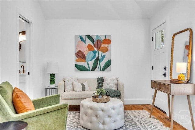 2136 Indiana Ave, Savannah, GA 31404 - living area featuring wood finished floors, lofted ceiling, and baseboards
