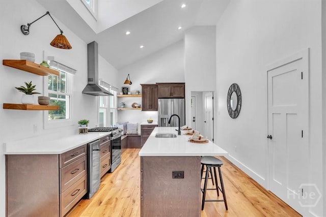 2136 Indiana Ave, Savannah, GA 31404 - kitchen featuring open shelves, wall chimney range hood, stainless steel appliances, high vaulted ceiling, and a sink