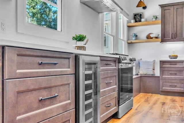 2136 Indiana Ave, Savannah, GA 31404 - kitchen featuring beverage cooler, ventilation hood, open shelves, and light countertops