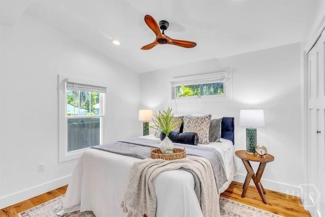 2136 Indiana Ave, Savannah, GA 31404 - bedroom featuring baseboards, wood finished floors, lofted ceiling, a ceiling fan, and a closet