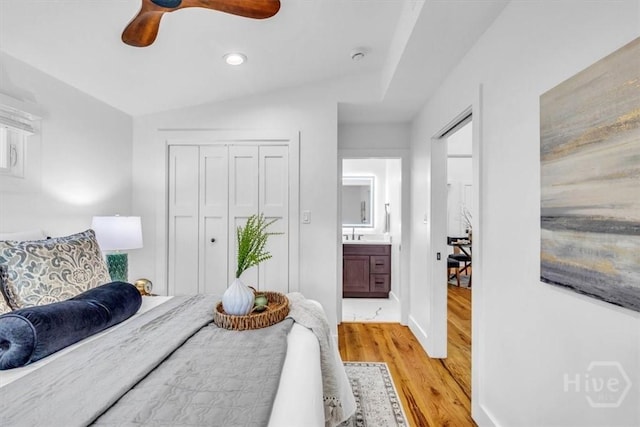 2136 Indiana Ave, Savannah, GA 31404 - bedroom with light wood-style flooring, recessed lighting, vaulted ceiling, baseboards, and a closet