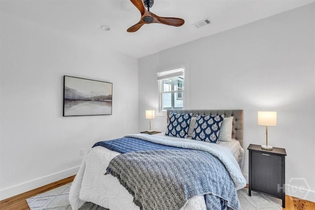 2136 Indiana Ave, Savannah, GA 31404 - bedroom with baseboards, light wood-type flooring, and a ceiling fan