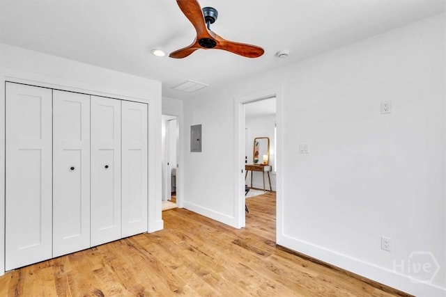 2136 Indiana Ave, Savannah, GA 31404 - unfurnished bedroom featuring electric panel, baseboards, a closet, light wood-style floors, and ceiling fan