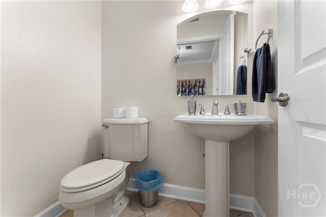 700 Wilmington Island Rd Unit 305, Savannah, GA 31410 - bathroom featuring baseboards, toilet, and tile patterned floors