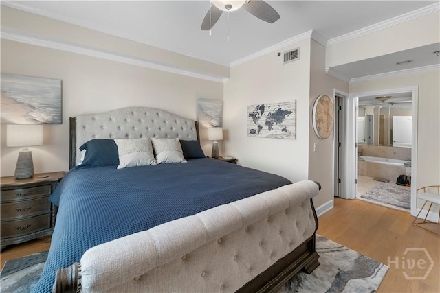 700 Wilmington Island Rd Unit 305, Savannah, GA 31410 - bedroom with wood finished floors, ornamental molding, baseboards, a ceiling fan, and ensuite bath