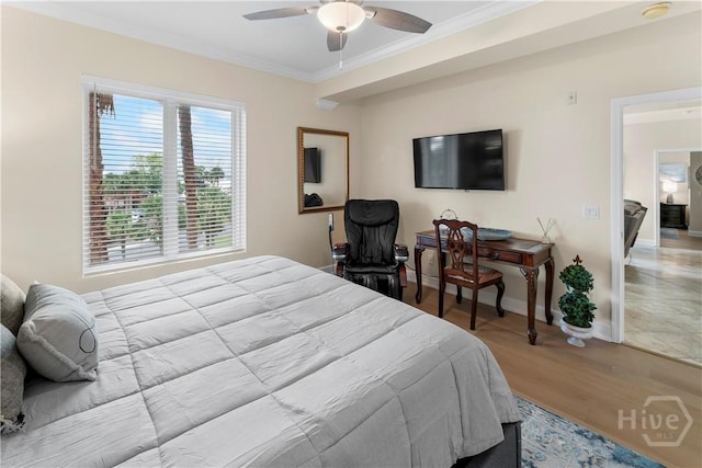 700 Wilmington Island Rd Unit 305, Savannah, GA 31410 - bedroom with crown molding, baseboards, wood finished floors, and ceiling fan