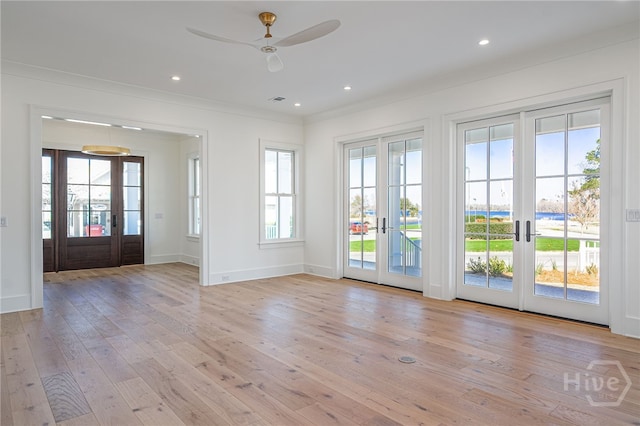 630 Ogeechee Ln, Richmond Hill, GA 31324 - unfurnished room featuring french doors, light wood-style floors, a ceiling fan, crown molding, and baseboards