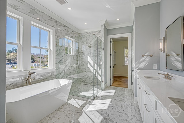 630 Ogeechee Ln, Richmond Hill, GA 31324 - bathroom featuring a marble finish shower, crown molding, a freestanding bath, double vanity, and recessed lighting