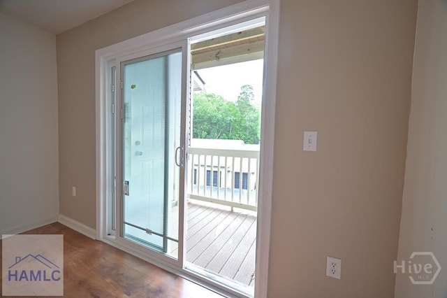 12300 Apache Ave Unit 604, Savannah, GA 31419 - doorway to outside with wood finished floors and baseboards