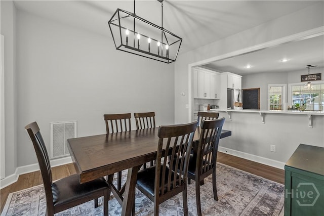 117 Myrtlewood Dr, Guyton, GA 31312 - dining area featuring dark wood-type flooring, a chandelier, baseboards, and recessed lighting