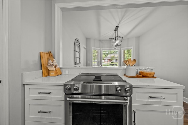 117 Myrtlewood Dr, Guyton, GA 31312 - kitchen featuring high end stainless steel range, white cabinets, light countertops, and pendant lighting