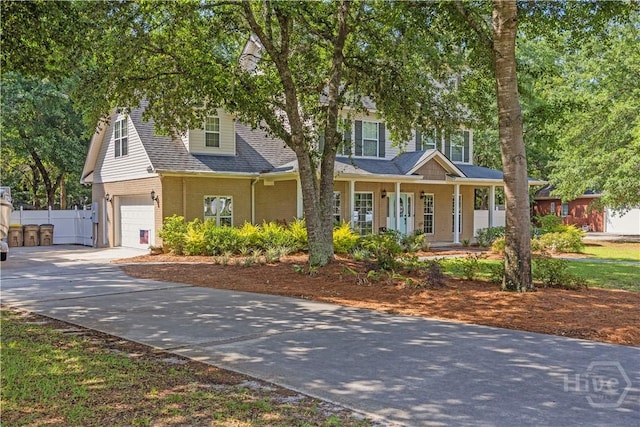 117 Myrtlewood Dr, Guyton, GA 31312 - view of front of home with a garage, brick siding, a porch, concrete driveway, and a shingled roof