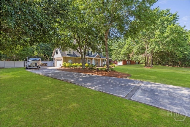 117 Myrtlewood Dr, Guyton, GA 31312 - obstructed view of property with a garage, driveway, and view of scattered trees