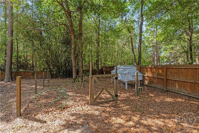 117 Myrtlewood Dr, Guyton, GA 31312 - fenced backyard featuring exterior structure and an outbuilding