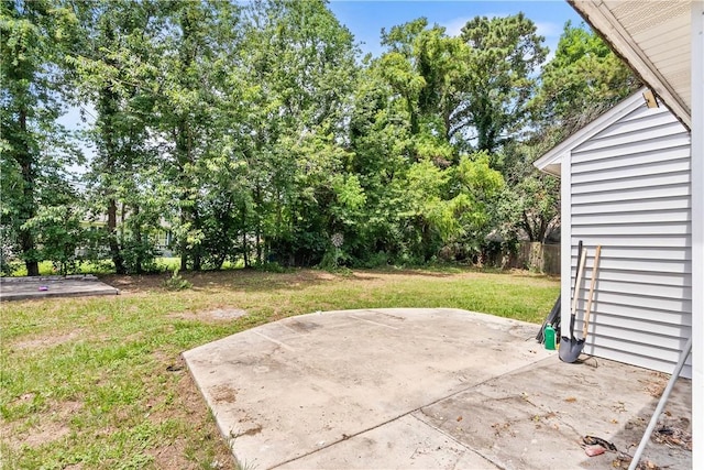 103 Mapmaker Cv, Savannah, GA 31410 - view of green lawn featuring a patio and view of wooded area